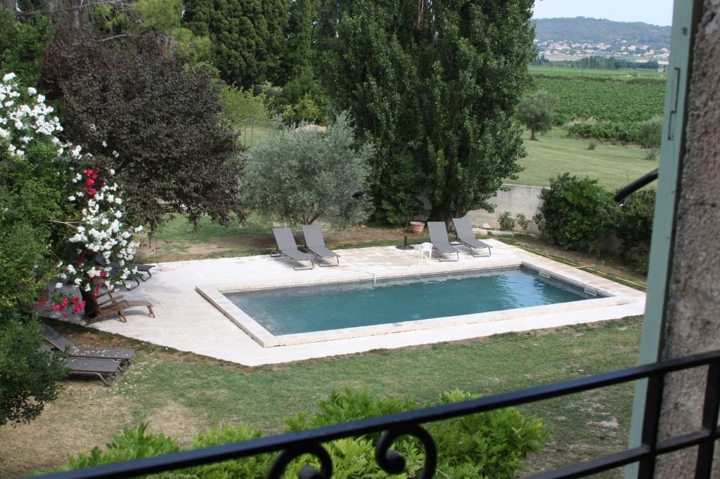 View of pool from a bedroom